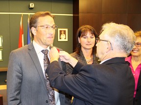 Stony Plain Canadian Legion president John Cannon, right, pins a poppy on the lapel of Parkland County Mayor Rod Shaigec at the County’s committee of the whole meeting Nov. 3, marking the start of the poppy campaign in the tri-area. - Photo Supplied