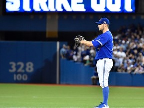 Toronto Blue Jays starting pitcher Marco Estrada stands on the mound after striking out a Kansas City Royals batter during Game 5 of the American League Championship Series at Rogers Centre in Toronto on Oct. 21, 2015. (THE CANADIAN PRESS/Nathan Denette)