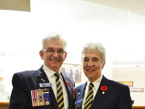 Outgoing Stony Plain Legion president John Cannon and Helen Cannon show poppies ready for distribution in 2013. The Cannons will be missed by their local Legion when they move to B.C. in December. - Thomas Miller, File Photo