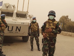 UN peacekeepers of the United Nations Interim Force in Lebanon wear face masks while they monitor the Lebanese-Israeli border during a sandstorm in Kfar Kila village, in south Lebanon in September. 
Aziz Taher/Reuters