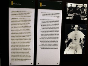 A photo of Pope Pius XII is seen next to a text in Hebrew and English in the museum at the Yad Vashem Holocaust Memorial in Jerusalem June 1, 2012. AFP PHOTO/MENAHEM KAHANA