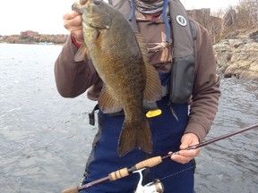 Local tournament pro and fishing guide Frank Clark shows a nice fall smallmouth bass caught on Ramsey Lake in the heart of Sudbury earlier this week.