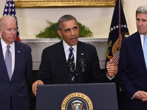U.S. President Barack Obama, accompanied by Vice President Joe Biden and Secretary of State John Kerry, announces he's rejecting the Keystone XL pipeline because he does not believe it serves the national interest on Friday, Nov. 6, 2015, in the Roosevelt Room of the White House in Washington. (AP Photo/Susan Walsh)