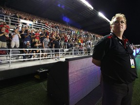 Jeff Hunt, owner and president of the Ottawa Redblacks, looks on from the sidelines during the franchise home opener against the Toronto Argonauts at TD Place Stadium on July 18, 2014 in Ottawa, Ontario, Canada.  Andre Ringuette/Freestyle Photography/Getty Images/AFP