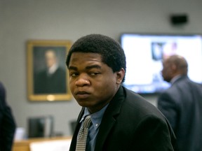 Rashad Owens looks at his mother and step father as he leaves the courtroom after closing arguments in his murder trial on Friday, Nov. 6, 2015, in Austin, Texas. A jury on Friday found Owens guilty of capital murder in a crash that killed four people last year at the South by Southwest festival in Austin. (Laura Skelding /Austin American-Statesman via AP)