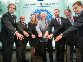 Chris Pronger, left to right, Peter Karmanos, Angela Ruggiero, Bill Hay, Nicklas Lidstrom, Phil Housley and Sergei Fedorov pose for a group photograph as they show off their rings following a ring presentation at a ceremony to kick off Hockey Hall of Fame weekend in Toronto on Friday, November 6, 2015. (THE CANADIAN PRESS/Chris Young)