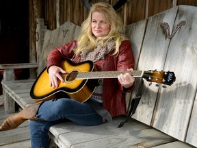 London-area singer Shelly Rastin relaxes Friday on the porch at the Thorndale-area Purple Hill country music hall. Rastin is here Saturday, backed by the venue?s band, to sing classic country hits. (MORRIS LAMONT, The London Free Press)