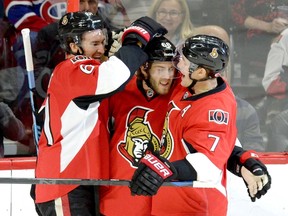 Ottawa Senators' Mike Hoffman (68) celebrates his goal against the Montreal Canadiens with teammates Mark Stone (61) and Kyle Turris (7) during the first period of a pre-season NHL hockey game, Saturday October 3, 2015, in Ottawa. THE CANADIAN PRESS/Justin Tang