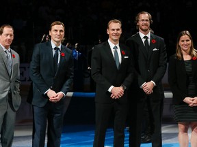 Hockey Hall of Fame inductees (from left to right) Phil Housley, Sergei Fedorov, Nicklas Lidstrom, Chris Pronger and Angela Ruggiero are introduced to hockey fans attending the Maple Leafs game against the Red Wings in Toronto on Friday, Nov. 6, 2015. (Stan Behal/Toronto Sun)