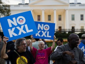 Demonstrators, celebrating US President Barack Obama's blocking of the Keystone XL oil pipeline, rally in front of the White House in Washington, DC on November 6, 2015. US President Barack Obama blocked the Keystone XL oil pipeline that Canada sought to build into the United States, ruling it would harm the fight against climate change. (AFP PHOTO/ ANDREW CABALLERO-REYNOLDS)