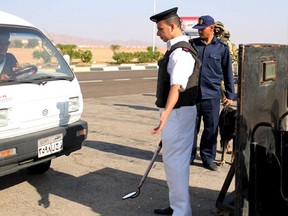 Police inspects cars going into the airport of the Red Sea resort of Sharm el-Sheikh, November 7, 2015. Egypt criticised its foreign partners on Saturday for ignoring calls to work harder to combat terrorism, after Western intelligence sources said there were signs Islamist militants may have bombed the Russian plane which crashed in Sinai. An Islamic State affiliate has claimed responsibility for the crash of the Airbus A321 operated by a Russian carrier that was bringing holidaymakers home from the Sinai Peninsula resort of Sharm al-Sheikh one week ago. All 224 people on board were killed in what the militants described as revenge for Russian air strikes against Islamist fighters in Syria. (REUTERS/Asmaa Waguih)