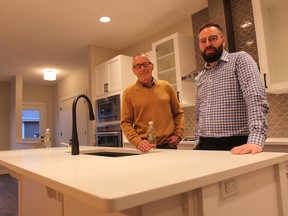 Cutline: Architect Doug Kelly (left) and Matt Kaprowy, president of of Kirkland Homes are two of the people trying to make skinny homes in Edmonton's mature neighbourhoods more commonplace. They've already built a handful of the homes and hope city policies can ease the entry for builders wanting to do more. DAVE LAZZARINO/EDMONTON SUN