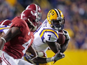 In this Nov. 8, 2014, file photo, LSU running back Leonard Fournette (7) carries the ball against Alabama in Baton Rouge, La. (AP Photo/Gerald Herbert, File)