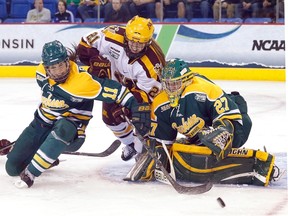 Erica Howe of the Clarkson Golden Knights deals with traffic in front of the net during the 2014 NCAA Women’s Ice Hockey Championship at TD Bank Sports Center on March 23, 2014 in Hamden, Connecticut. (Jim Rogash/Getty Images/AFP)