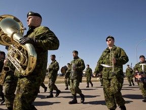 Members of the Royal Canadian Artillery Band march before National Day of Honour ceremonies at CFB Edmonton in Edmonton, Alta., on Friday, May 9, 2014. The cross-Canada event was held in recognition of the Canadian military's contributions to the military mission in Afghanistan. Ian Kucerak/Edmonton Sun/QMI Agency