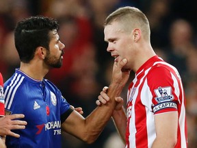 Chelsea’s Diego Costa (left) clashes with Stoke City’s Ryan Shawcross during English Premier League play Saturday at Britannia Stadium. (Action Images via Reuters/Ed Sykes)