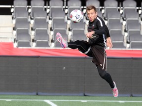 Ottawa Fury FC forward Oliver jumps to make contact with a high ball during training at TD Place on Thursday, Nov. 5, 2015. (Chris Hofley/Ottawa Sun)