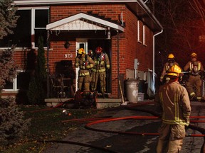 Kingston Fire and Rescue respond to 920 Uxbridge Cres. where they discovered a fully engulfed home in Kingston, Ont. on Saturday November 7, 2015. Julia McKay/The Kingston Whig-Standard/Postmedia Network
