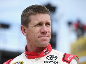 Carl Edwards, driver of the #19 Sport Clips Toyota, stands in the garage area during practice for the NASCAR Sprint Cup Series AAA Texas 500 at Texas Motor Speedway on November 6, 2015 in Fort Worth, Texas.  (Sean Gardner/AFP)