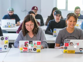 Coding students pose for a classroom photo at HackerYou in Toronto. (Ernest Doroszuk/Toronto Sun/Postmedia Network)