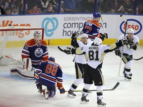 Pittsburgh Penguins celebrate Phil Kessel (81) goal during third period NHL action at Rexall Place in Edmonton, Alberta on November 6, 2015.  Perry Mah/Edmonton Sun/Postmedia Network