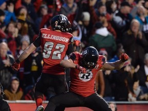 Ottawa Redblacks' wide receiver Greg Ellingson, left, celebrates his touchdown with teammate, fullback Patrick Lavoie, during first half CFL action against the Hamilton Tiger-Cats, in Ottawa, on Saturday, Nov. 7, 2015. THE CANADIAN PRESS/Adrian Wyld