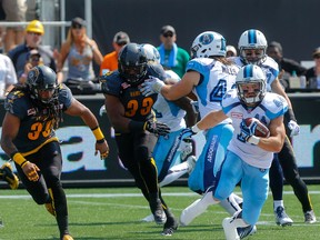 Toronto Argos  Chad Kackert, tries to make for a first down vs. Hamilton Tiger-Cats at the Tim Hortons Field in Hamilton, Ont. on Monday September 7, 2015. (Dave Thomas/Postmedia Network)