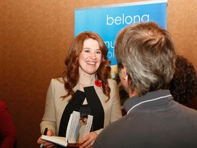 Six-time Olympian Clara Hughes speaks with people who attended the Pathways to Independence 25 anniversary event.