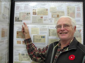 Mike Deery stands in front of one of the five panels he entered in the Kentpex stamp exhibition held in Chatham on Saturday, Nov. 7, 2015. He is pictured here pointing to an example of mail that was censored during the Second World War. (Don Robinet, Postmedia Network)