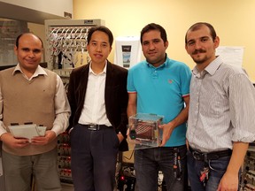 University of Waterloo professor Zhongwei Chen and members of his team of graduate students pose with their new silicon-based lithium-ion battery. From left, Fathy Hassan, Chen, Ali Ghorbani and Rasim Batmaz. (Michael Peake/Toronto Sun)