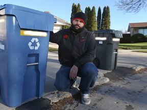 Marcio Chaves is seen at the end of his driveway in the Maples on Sunday, Nov. 8, 2015. Chaves has issues with his garbage and recycling pickup. (Kevin King/Winnipeg Sun/Postmedia Network)