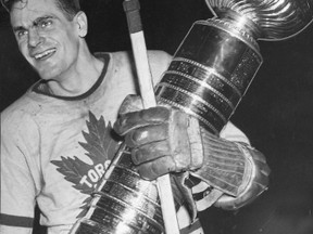 Syl Apps holds the Stanley Cup after the Maple Leafs defeated the Red Wings in seven games in 1942.