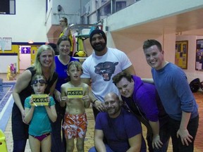 Liam Binks, 9, and Audrey Seaton, 8, pose for a photo with Amazing Race Canada contestants Nick Foti and Matt Giunta and Brent and Sean Sweeney at at the Jeno Tihanyi Olympic Gold Pool. Photo supplied