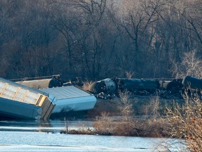 Train cars lie overturned outside of Alma, Wis. after derailing on Saturday, Nov. 7, 2015. BNSF Railway said multiple tanker cars leaked ethanol into the Mississippi River on Saturday. (Aaron Lavinsky/Star Tribune via AP)