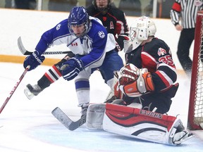 Sudbury Wolves minor midget Billy Moskal loses control of the puck in front of Soo Indians goalie Will Hartwick during Big Nickel Hockey Tournament semi-final action from the Gerry McCrory Countryside Sports Complex in Sudbury, Ont. on Sunday November 8, 2015. Gino Donato/Sudbury Star/Postmedia Network