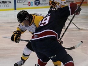 Sarnia Sting centre Pavel Zacha and Saginaw Spirit pivot Connor Brown battle for the faceoff win during the Ontario Hockey League game at the Sarnia Sports and Entertainment Centre Sunday night. The Sting won 3-1. (Terry Bridge, Sarnia Observer)