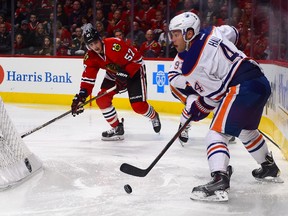 Nov 8, 2015; Chicago, IL, USA;  Edmonton Oilers left wing Taylor Hall (4) skates with the puck against the Chicago Blackhawks during the second period at the United Center. Credit: Mike DiNovo-USA TODAY Sports