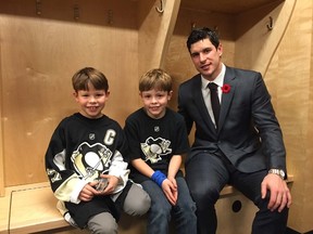 Pittsburgh Penguins' Sidney Crosby meets with Mason Rodriguez, 8, (L) a recovering young cancer patient, following Saturday's game against the Calgary Flames in Calgary, Alta November 7, 2015. The ten minute session saw Crosby and Mason chatting about hockey and making a short video clip for Mason's team, the McKnight Mustangs. Mom Jennifer, dad Diego and nine-year-old brother Bennett were in attendance. Courtesy Rodriguez family