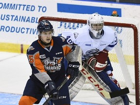 Jack Finn #40 is screens by Vincent Scognamiglio #15 of the Mississauga Steelheads of the Flint Firebirds during OHL game action on October 4, 2015 at the Hershey Centre in Mississauga, Ontario, Canada.  Graig Abel/Getty Images/AFP/Files