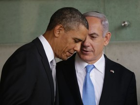 In this Friday, March 22, 2013 file photo, U.S. President Barack Obama, left, listens to Israeli Prime Minister Benjamin Netanyahu during their visit to the Children's Memorial at the Yad Vashem Holocaust memorial in Jerusalem.  (AP Photo/Pablo Martinez Monsivais, File)