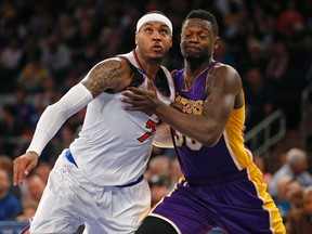New York Knicks forward Carmelo Anthony (7) and Los Angeles Lakers forward Julius Randle, right, look for a rebound in the second half of an NBA basketball game at Madison Square Garden in New York, Sunday, Nov. 8, 2015.  The Knicks won 99-95. (AP Photo/Kathy Willens)