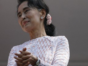 Myanmar's National League for Democracy party leader Aung San Suu Kyi looks at supporters after speaking about the general elections in Yangon, Myanmar Nov. 9, 2015. REUTERS/Jorge Silva