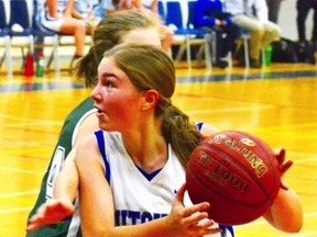 Lindsay Babb of the MDHS senior girls basketball team drives past a Stratford Central player to get a clean shot at the basket Nov. 2 during a senior girls basketball game at MDHS, a narrow 45-44 victory. GALEN SIMMONS/MITCHELL ADVOCATE