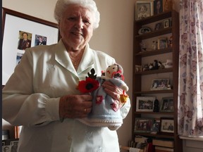 Dora Stewart shows her handcrafted Cinderella doll and an English poppy at the Seaforth Manor November 5.(Shaun Gregory/Huron Expositor)