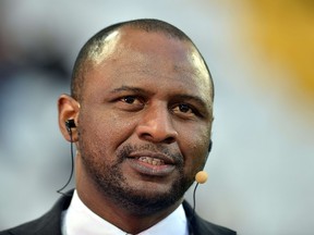 A file photo taken on April 10, 2013 shows French former football player Patrick Viera speaking on TV prior the UEFA Champions League quarter final second-leg football match Juventus vs FC Bayern Munich at the Juventus Stadium in Turin. Switzerland announced on June 24, 2014 that it will transmit to France, Patrick Vieira's bank account details regarding the assets of the former football player.   AFP PHOTO / GABRIEL BOUYS