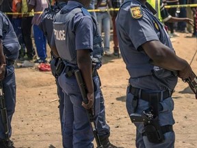 Policemen are pictured in this October 12, 2015 file photo in Johannesburg. (AFP PHOTO / MUJAHID SAFODIEN)