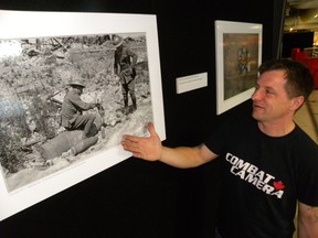 ERNST KUGLIN/THE INTELLIGENCER
Master Cpl. Pat Blanchard, a member of Combat Camera, talks about one of the photographs included in the Parallel exhibit on display at the National Air Force Museum of Canada. “All of the photographs tell a similar story – how soldiers 100 years earlier and those who served in Afghanistan go through the same thing. They perform the same tasks,” said Blanchard.