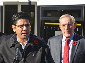 MPP Yasir Naqvi and Bob Chiarelli announce $34-million for Ottawa transportation projects while at Lincoln Fields Transit Station on Monday, Nov. 9, 2015. The money is the city’s share of provincial gas taxes. (SAM COOLEY Ottawa Sun / Postmedia)