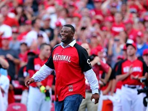 Ken Griffey Jr. walls out to throw the first pitch prior to the Home Run Derby at the Great American Ball Park on July 13, 2015 in Cincinnati. (Elsa/Getty Images/AFP)