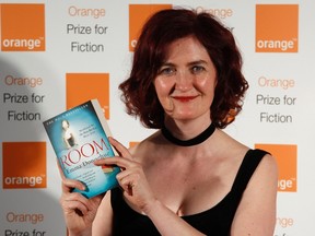 Emma Donoghue poses with her novel Room at the Royal Festival Hall. (Reuters file photo)